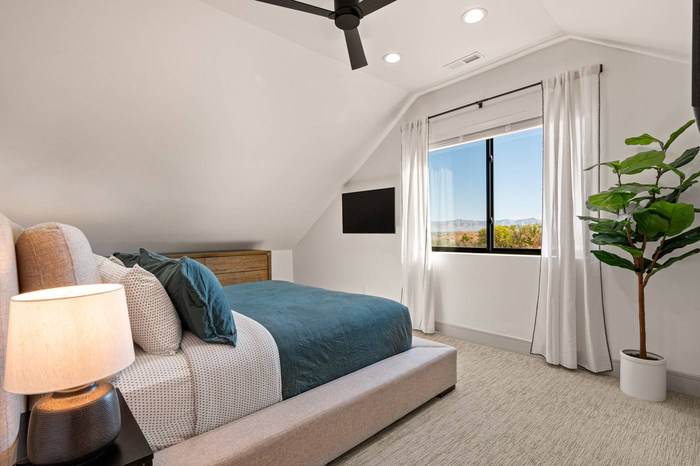 Guest bedroom with vaulted ceiling and Bookcliffs view